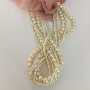 Faux pearl necklace with ribbon tie back